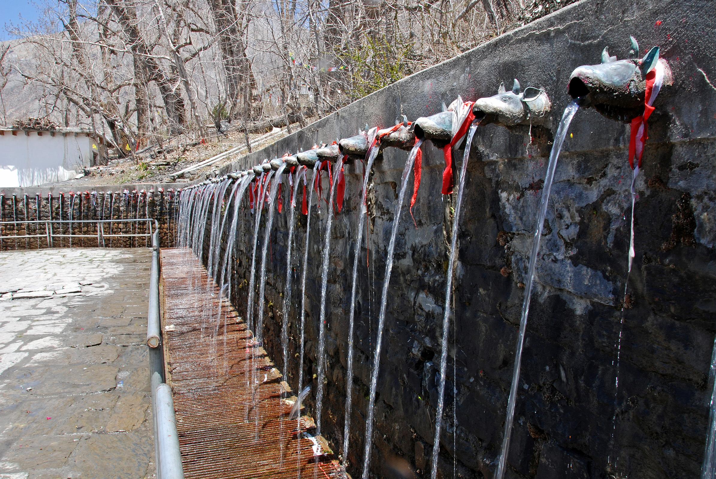 410 Muktinath Chumig Gyatsa 108 Water Spouts Set into the wall at the back of the Central Vishnu Chumig Gyatsa Temple at Muktinath are a set of 108 water spouts carved in the shape of bull�s heads.